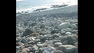 Jerking off at one's disposal the beach